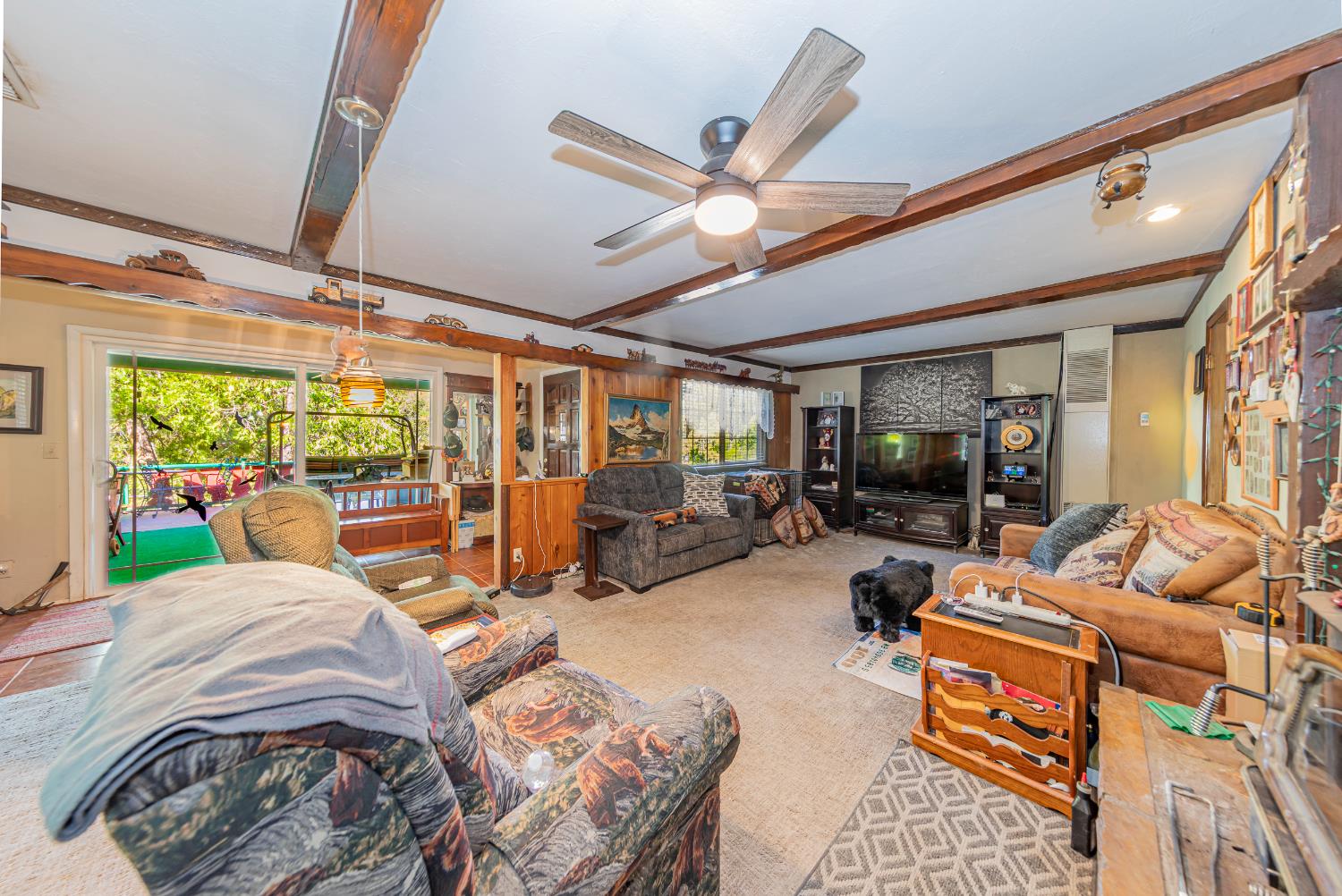 42585 Buckeye Road Oakhurst, CA 93644 - Photo 6 of 55 a bed room with a bed a couch and a large window