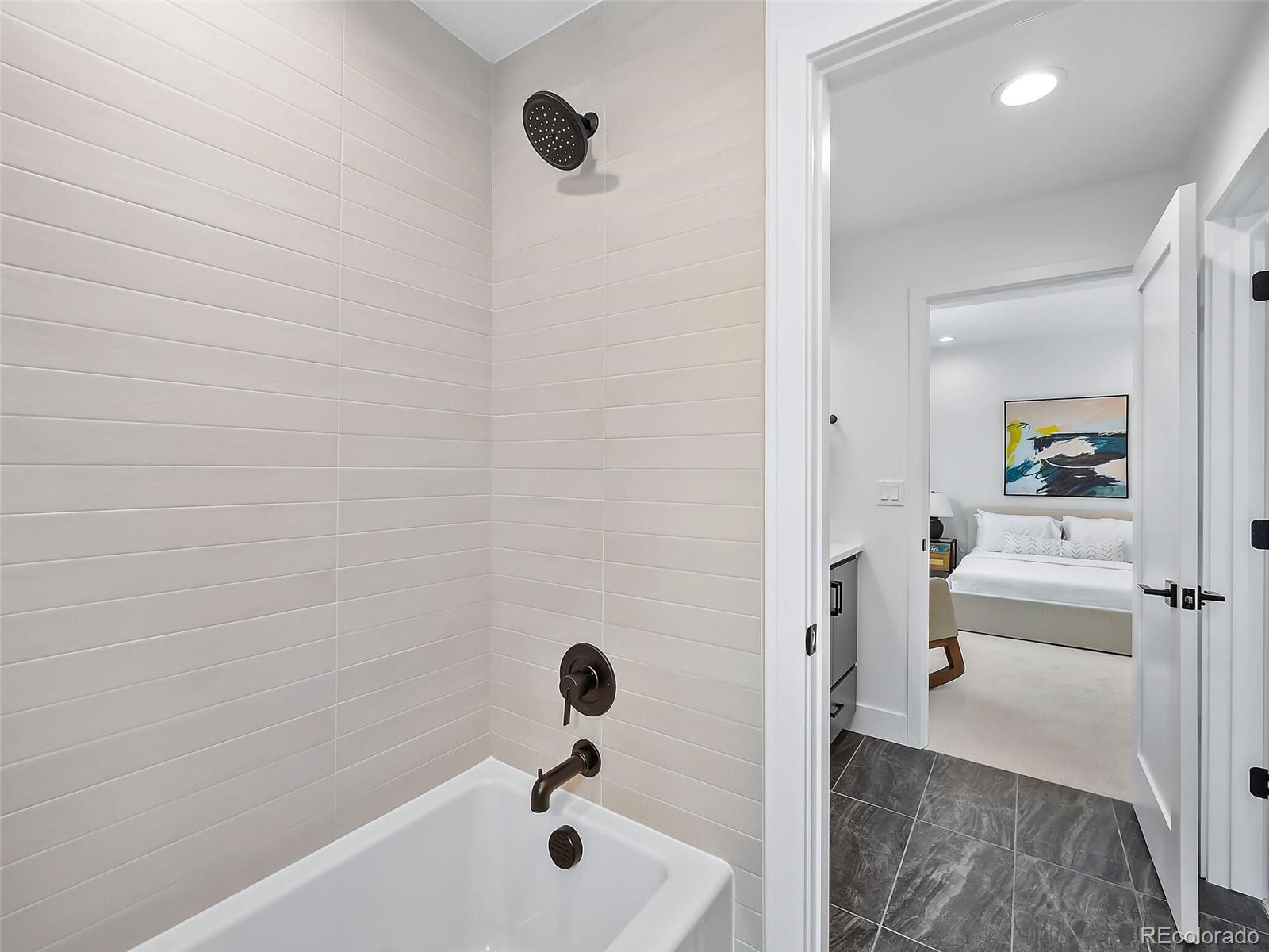 588 Adams Street Denver, CO 80206 - Photo 21 of 41 a bathroom with a tub and a sink