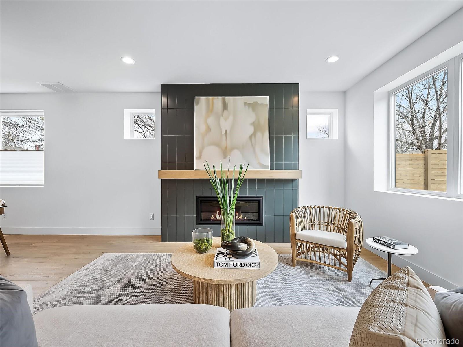 588 Adams Street Denver, CO 80206 - Photo 6 of 41 a living room with furniture and a large window
