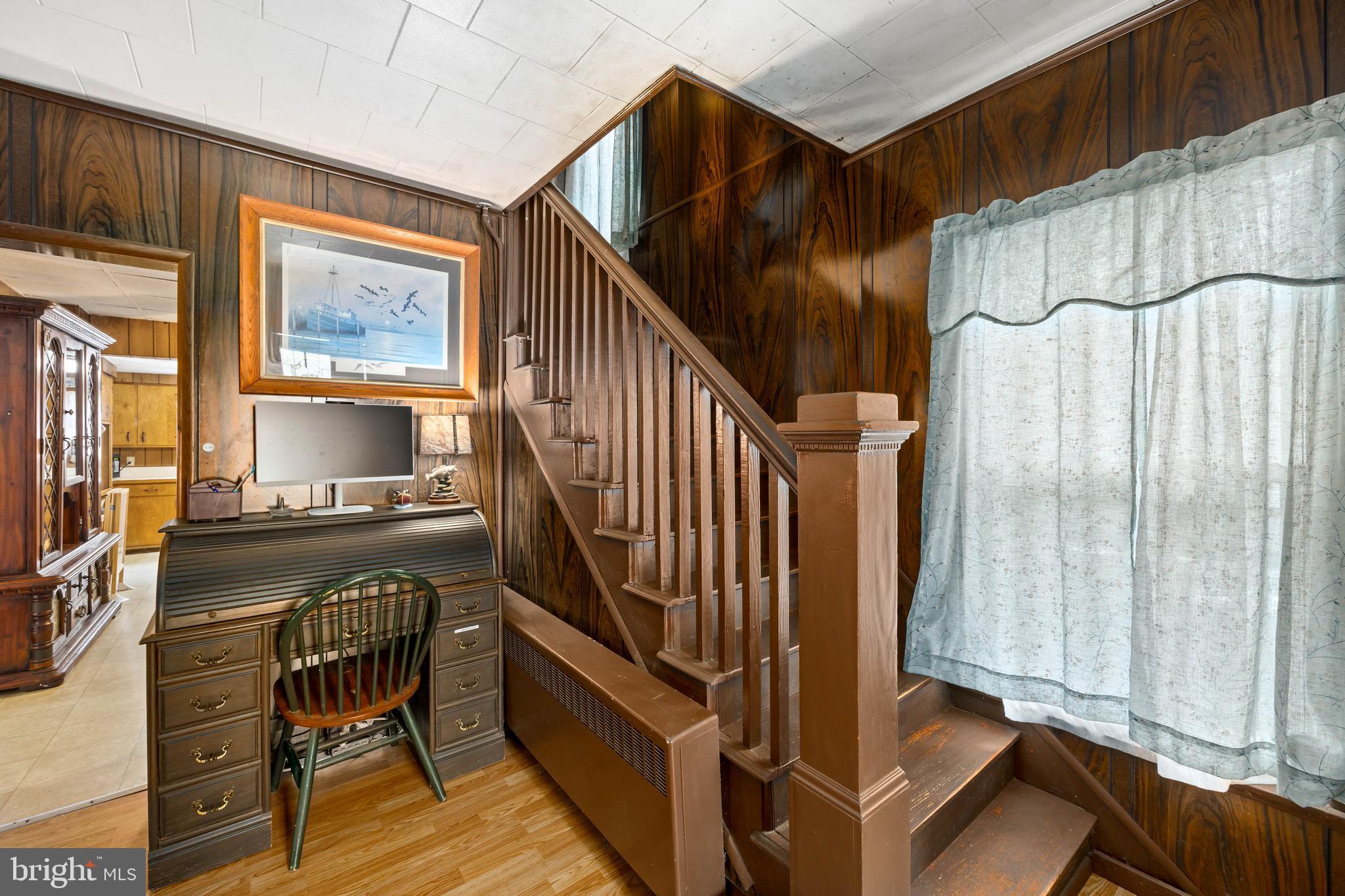 26467 Mariners Road Crisfield, MD 21817 - Photo 17 of 44 a view of entryway with wooden floor and windows