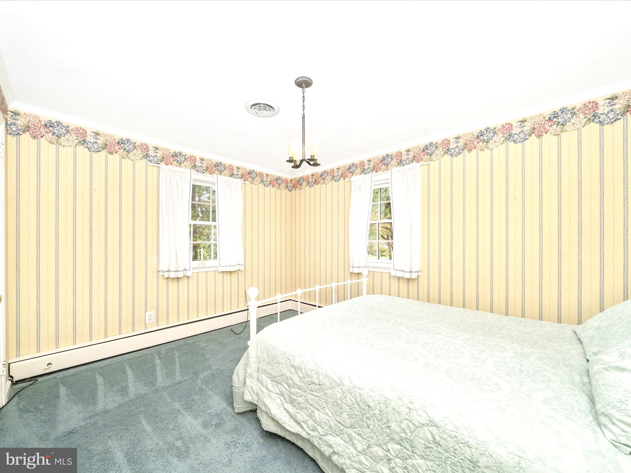 17920 Pin Oak Road Hagerstown, MD 21740 - Photo 26 of 57 a spacious bedroom with a bed and a window