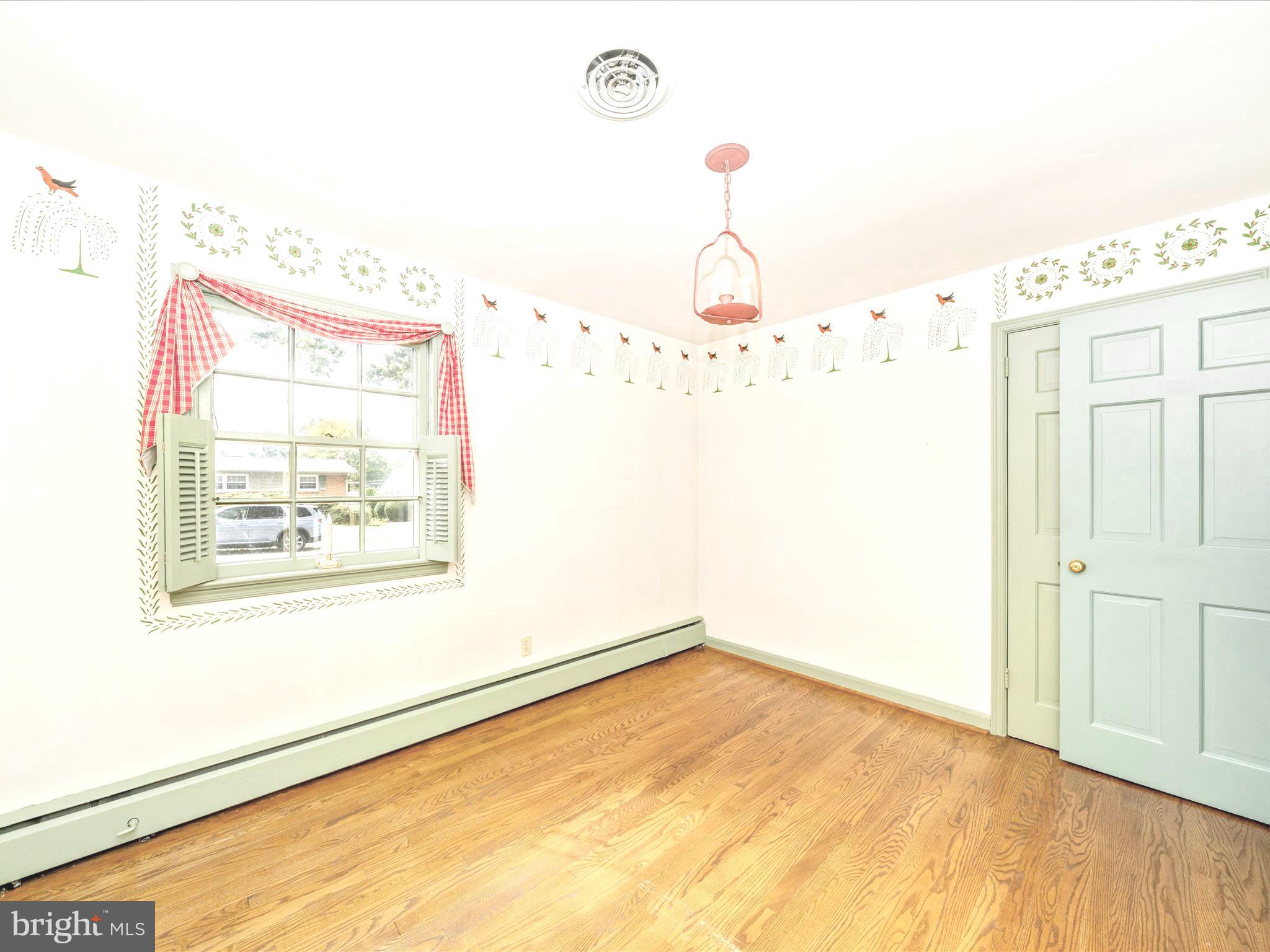 17920 Pin Oak Road Hagerstown, MD 21740 - Photo 30 of 57 a view of a room with wooden floor and windows