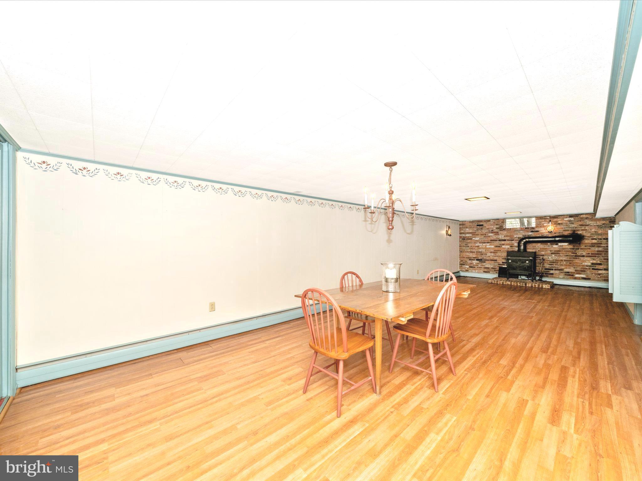 17920 Pin Oak Road Hagerstown, MD 21740 - Photo 35 of 57 a view of a dining room with furniture and wooden floor