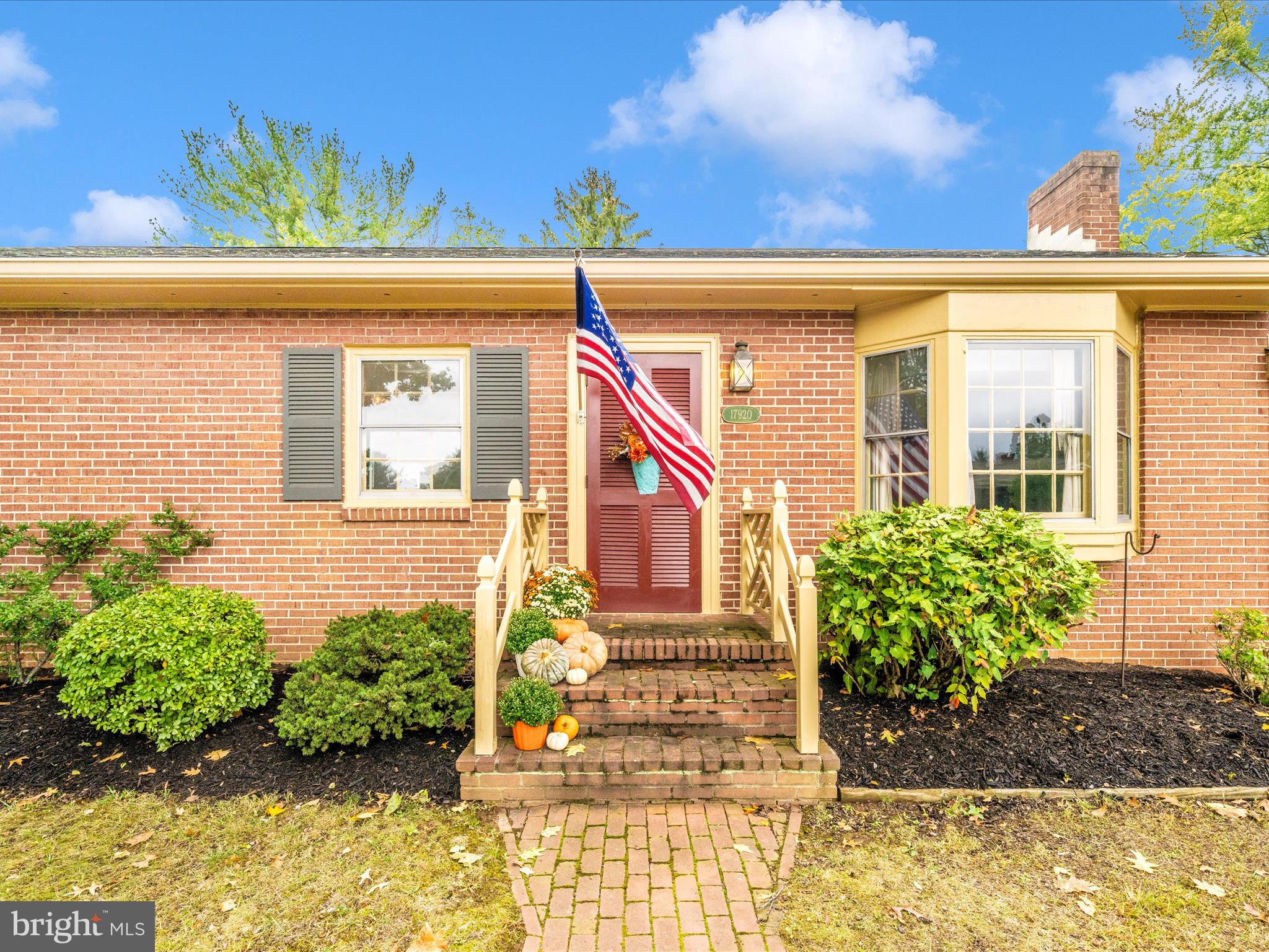 17920 Pin Oak Road Hagerstown, MD 21740 - Photo 56 of 57 a front view of a house with a garden