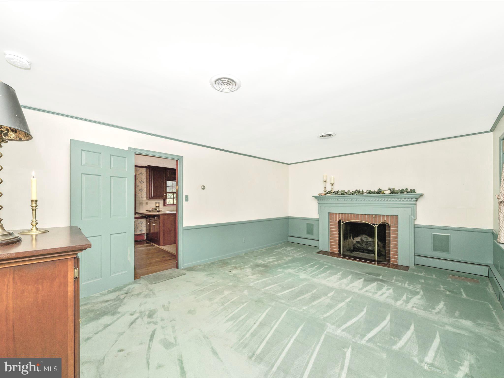 17920 Pin Oak Road Hagerstown, MD 21740 - Photo 7 of 57 a view of a livingroom with a fireplace and a window