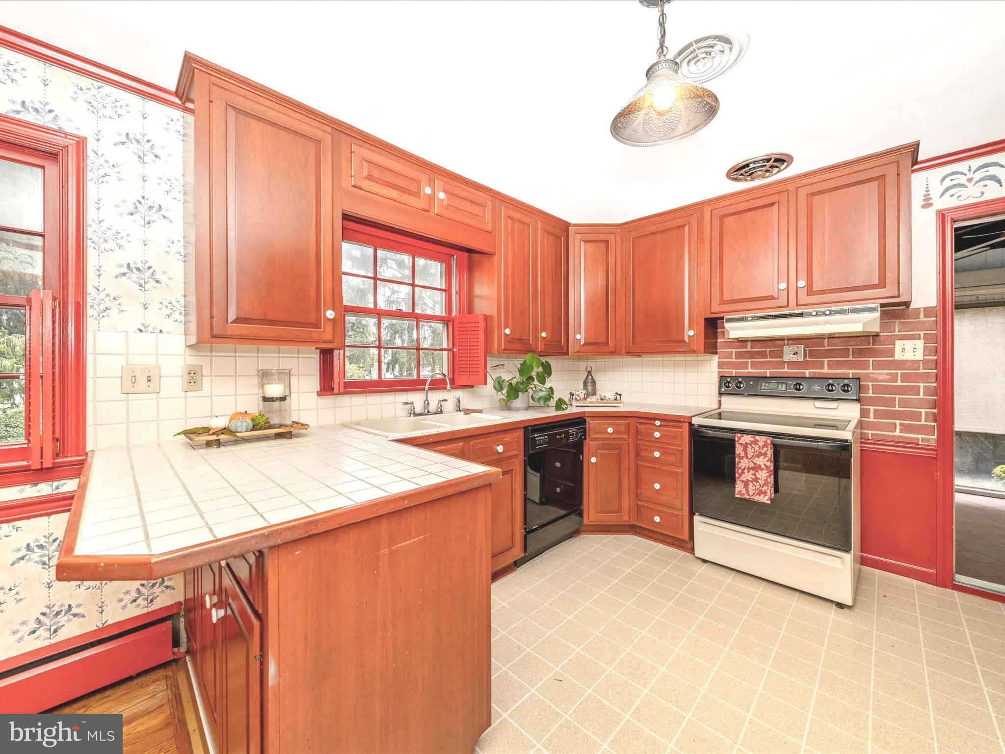 17920 Pin Oak Road Hagerstown, MD 21740 - Photo 9 of 57 a kitchen with stainless steel appliances granite countertop a stove a sink and a microwave