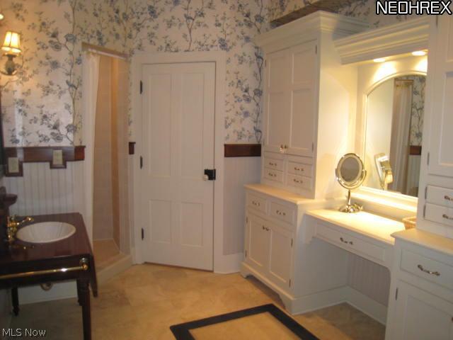 208 River Road Canal Fulton, OH 44614 - Photo 8 of 17 Spacious master bath with ceramic tile, vanity and walk-in closet.