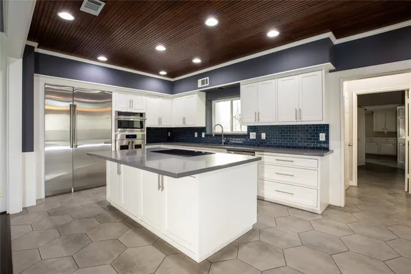 a kitchen with stainless steel appliances granite countertop a sink and stove