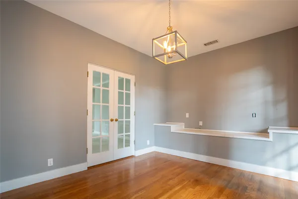 a view of an entryway with wooden floor