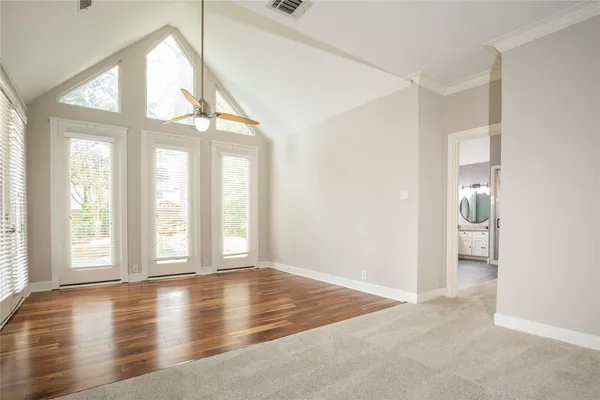a view of an empty room with a window