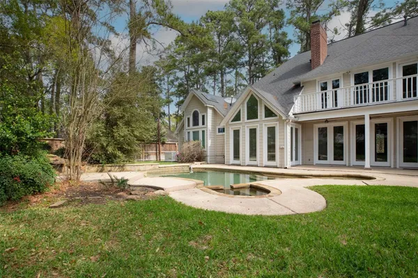 a view of an entryway with wooden floor and door