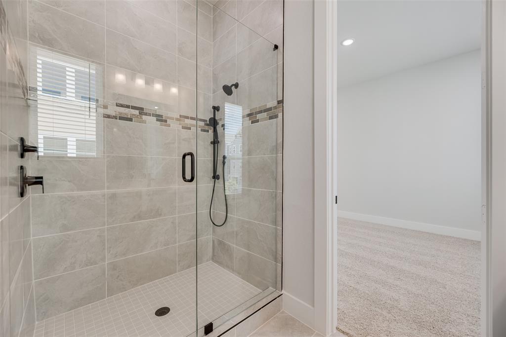 817 Ash Road Plano, TX 75075 - Photo 15 of 23 a bathroom with a shower