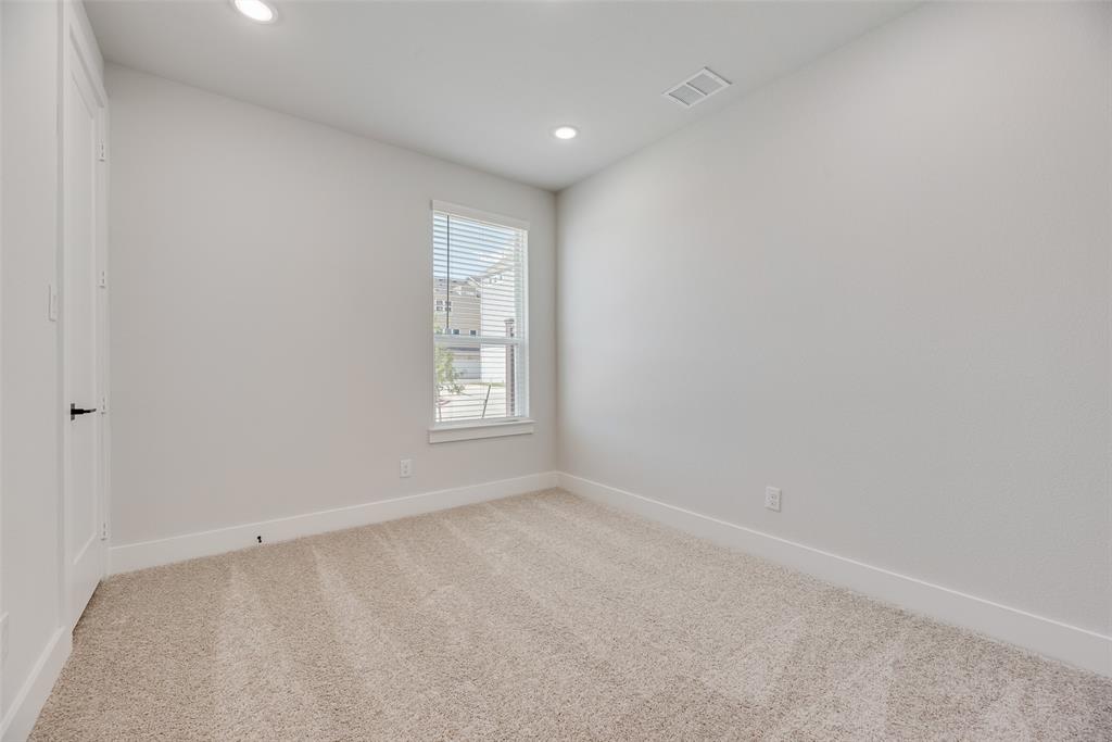 817 Ash Road Plano, TX 75075 - Photo 17 of 23 an empty room with windows