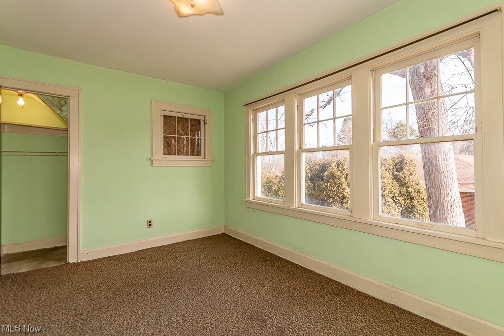 29396 Detroit Road Westlake, OH 44145 - Photo 22 of 30 Unfurnished bedroom with dark carpet and a closet