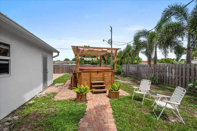 a view of a chairs and table in the patio