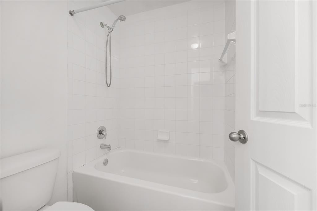 4824 Poolside Drive St. Cloud, FL 34769 - Photo 22 of 29 a close up of a bathtub curtain