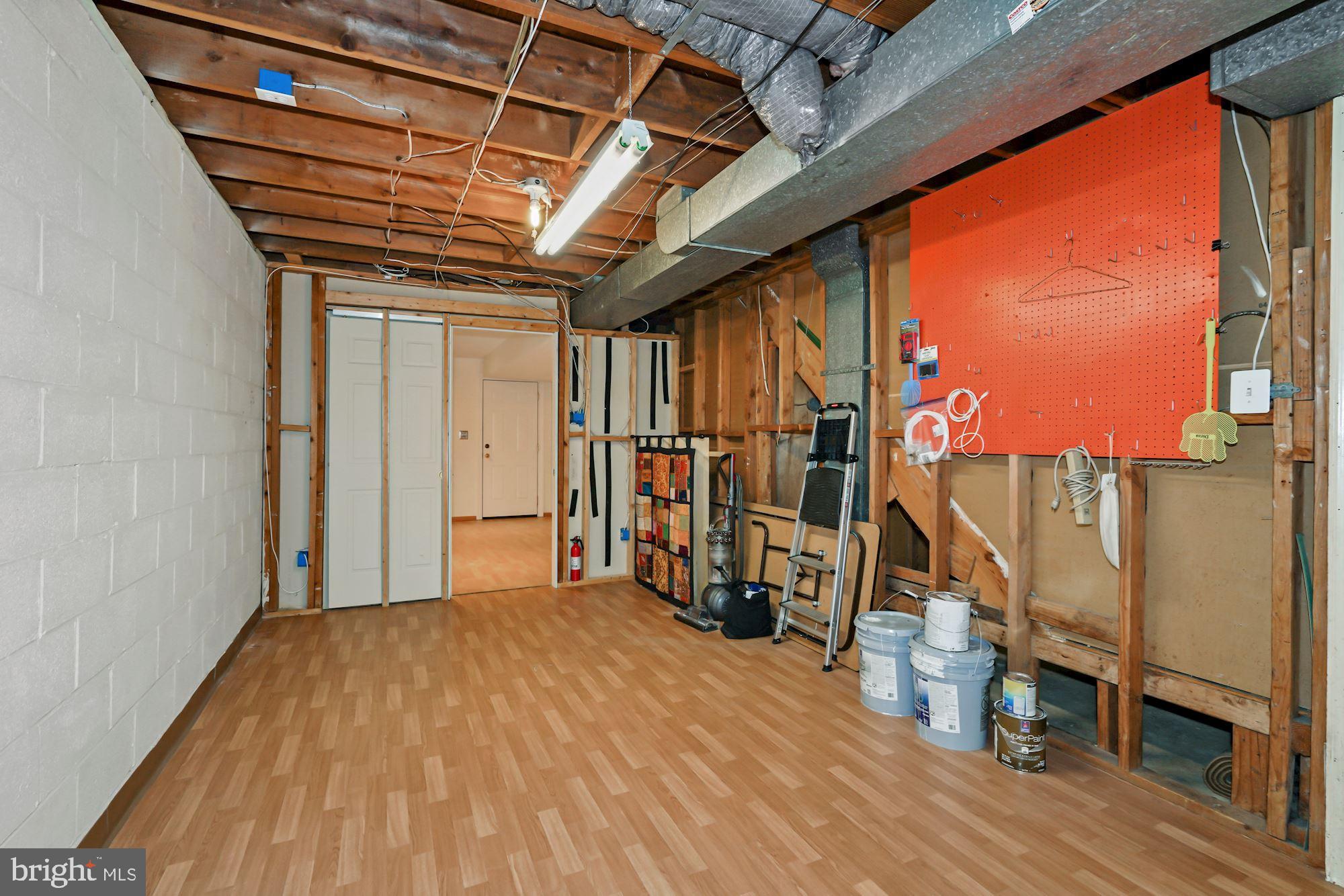 7417 Miller Fall Road Derwood, MD 20855 - Photo 12 of 38 Storage room area & pocket door to den/office