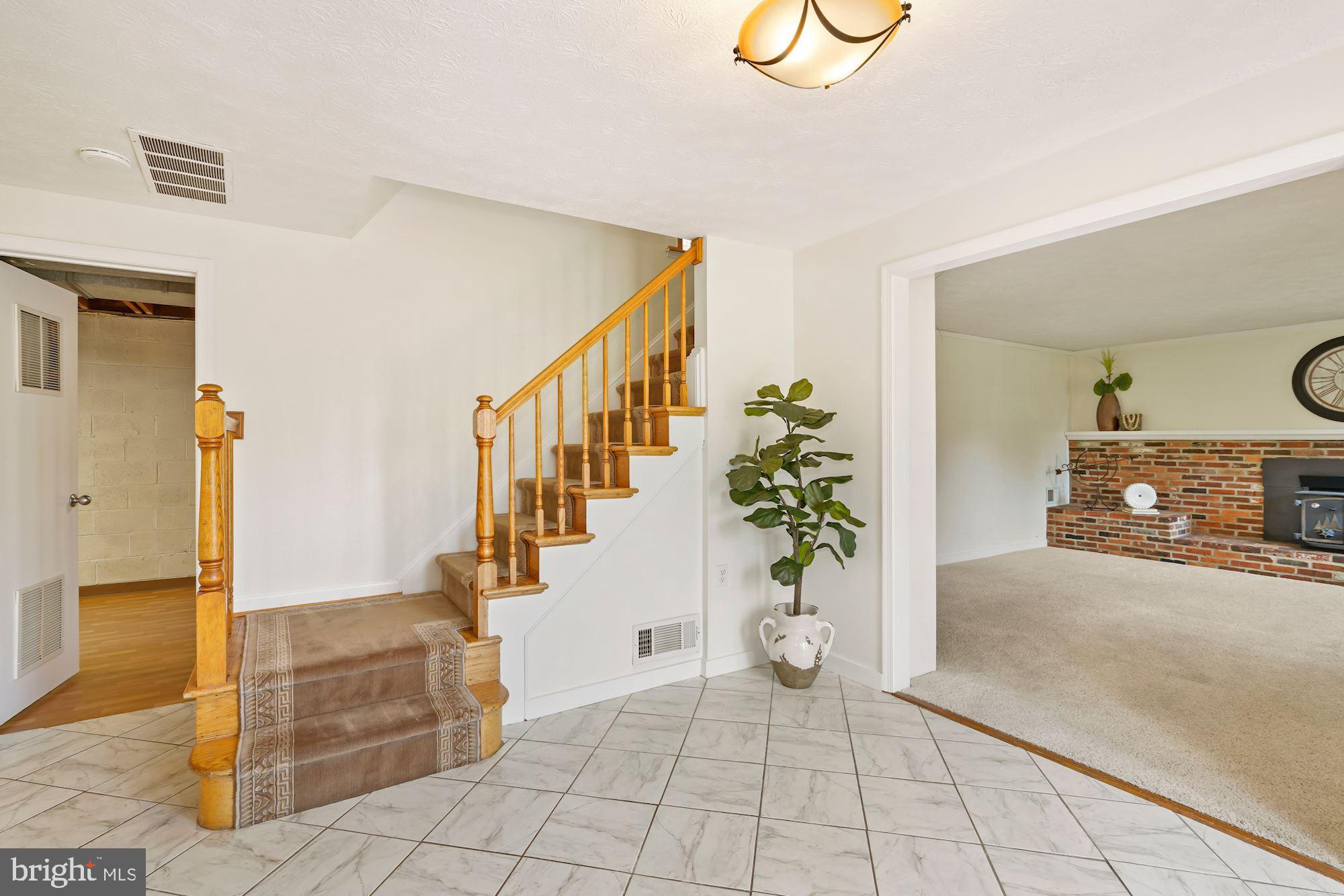 7417 Miller Fall Road Derwood, MD 20855 - Photo 5 of 38 Foyer entry with stairs to upper level