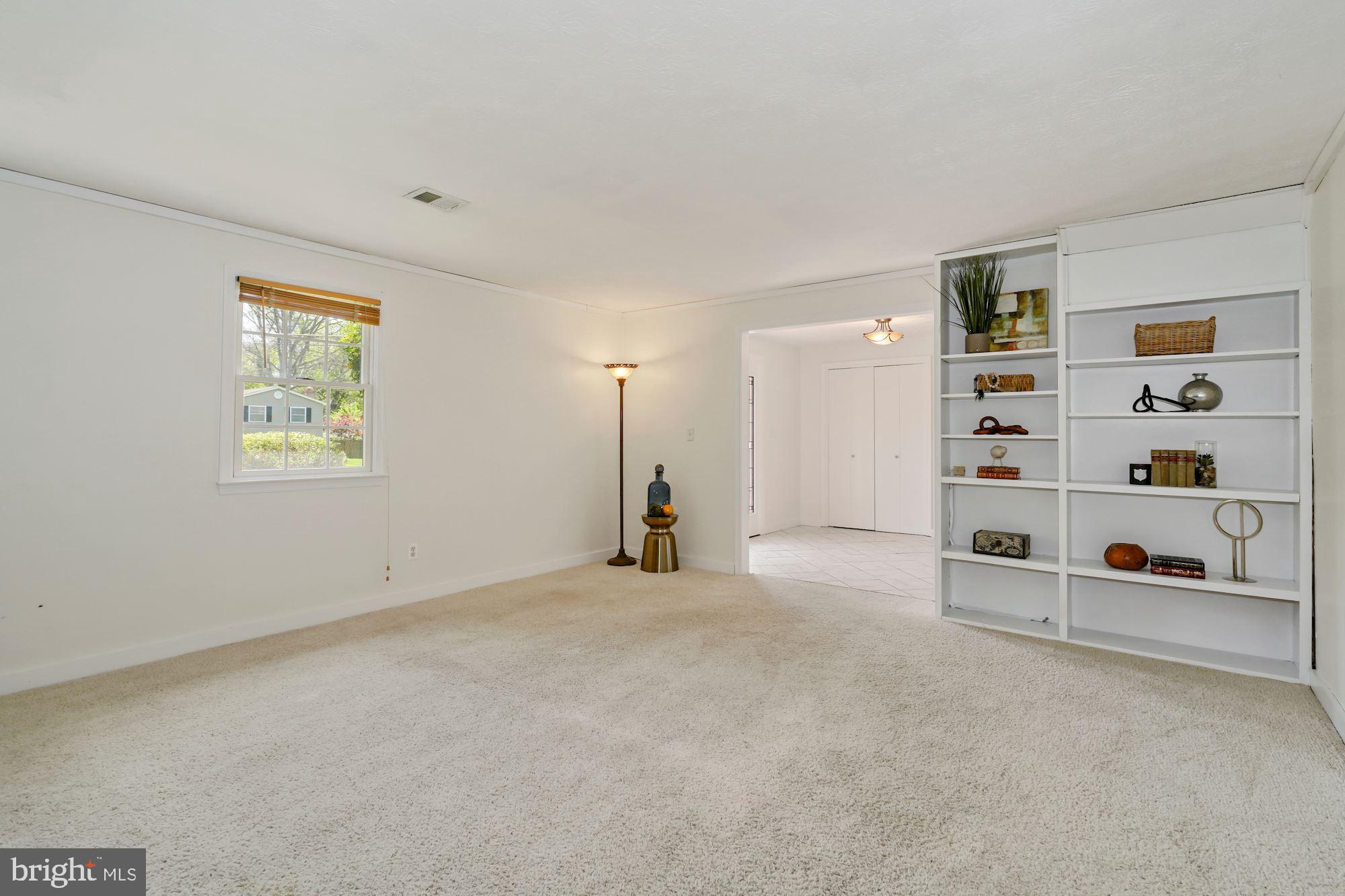 7417 Miller Fall Road Derwood, MD 20855 - Photo 7 of 38 Recreation room with built-in shelves