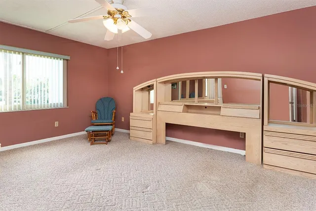 a bedroom with furniture and window