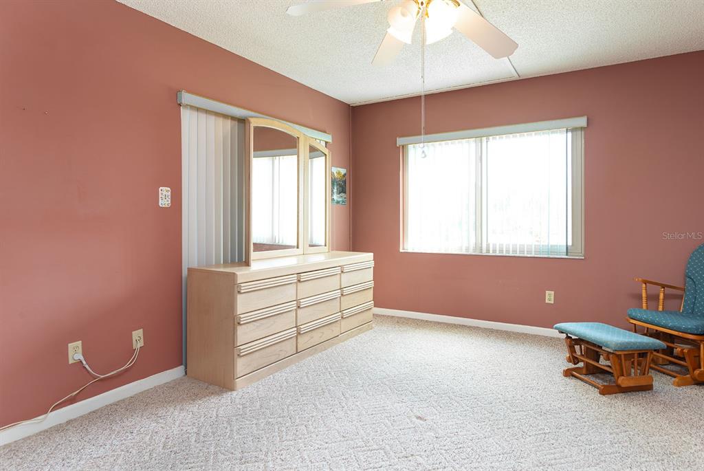 3 Escondido Circle, Unit 8 Altamonte Springs, FL 32701 - Photo 15 of 29 a room with window and a chandelier fan