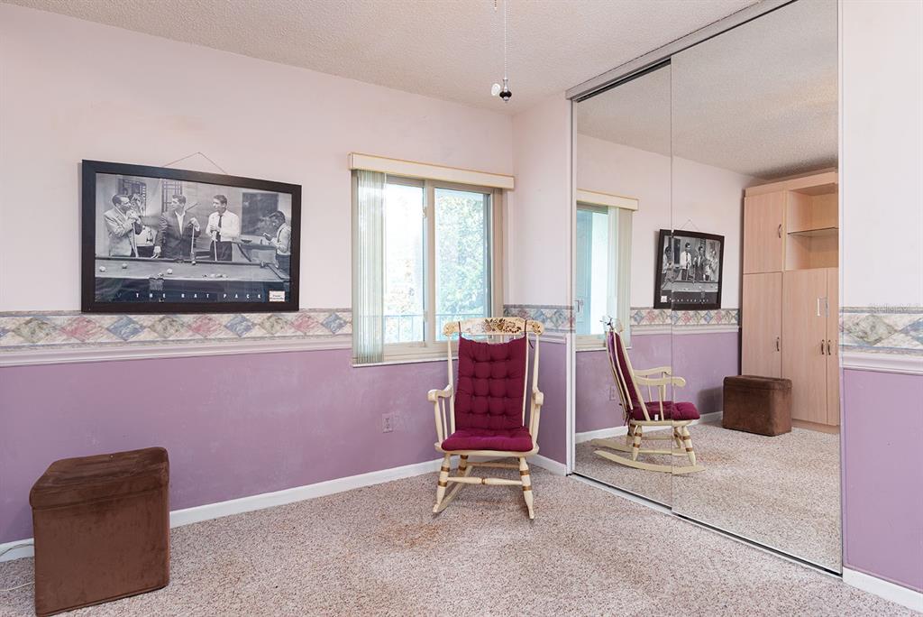 3 Escondido Circle, Unit 8 Altamonte Springs, FL 32701 - Photo 22 of 29 a room with furniture and window