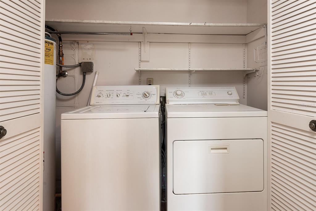 3 Escondido Circle, Unit 8 Altamonte Springs, FL 32701 - Photo 25 of 29 a utility room with dryer and washer