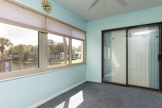 an aerial view of a house with a lake view