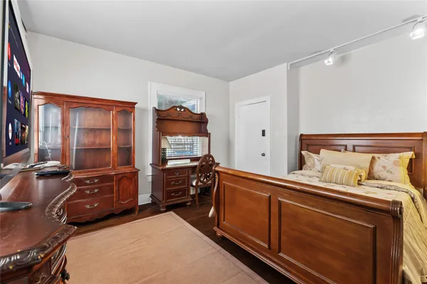 a bedroom with a bed and furniture