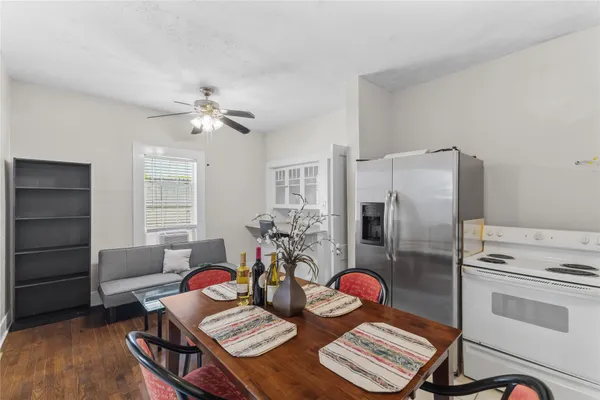 a view of a workspace with furniture and a chandelier