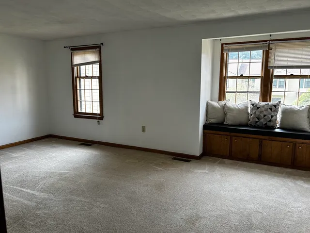 an empty room with windows