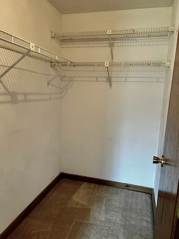 a view of a room with racks on the wall