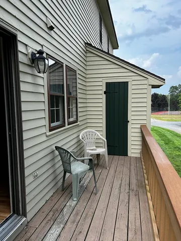 a view of a wooden deck with a table and chairs