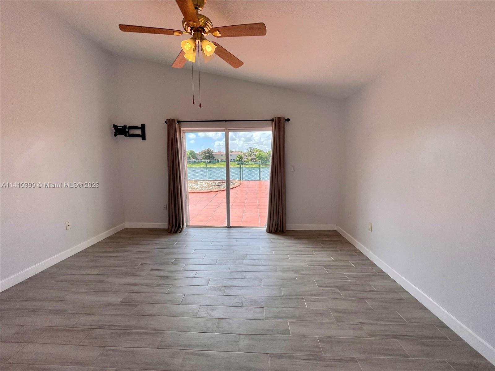12030 Southwest 135th Terrace Miami, FL 33186 - Photo 11 of 27 a view of an empty room with window