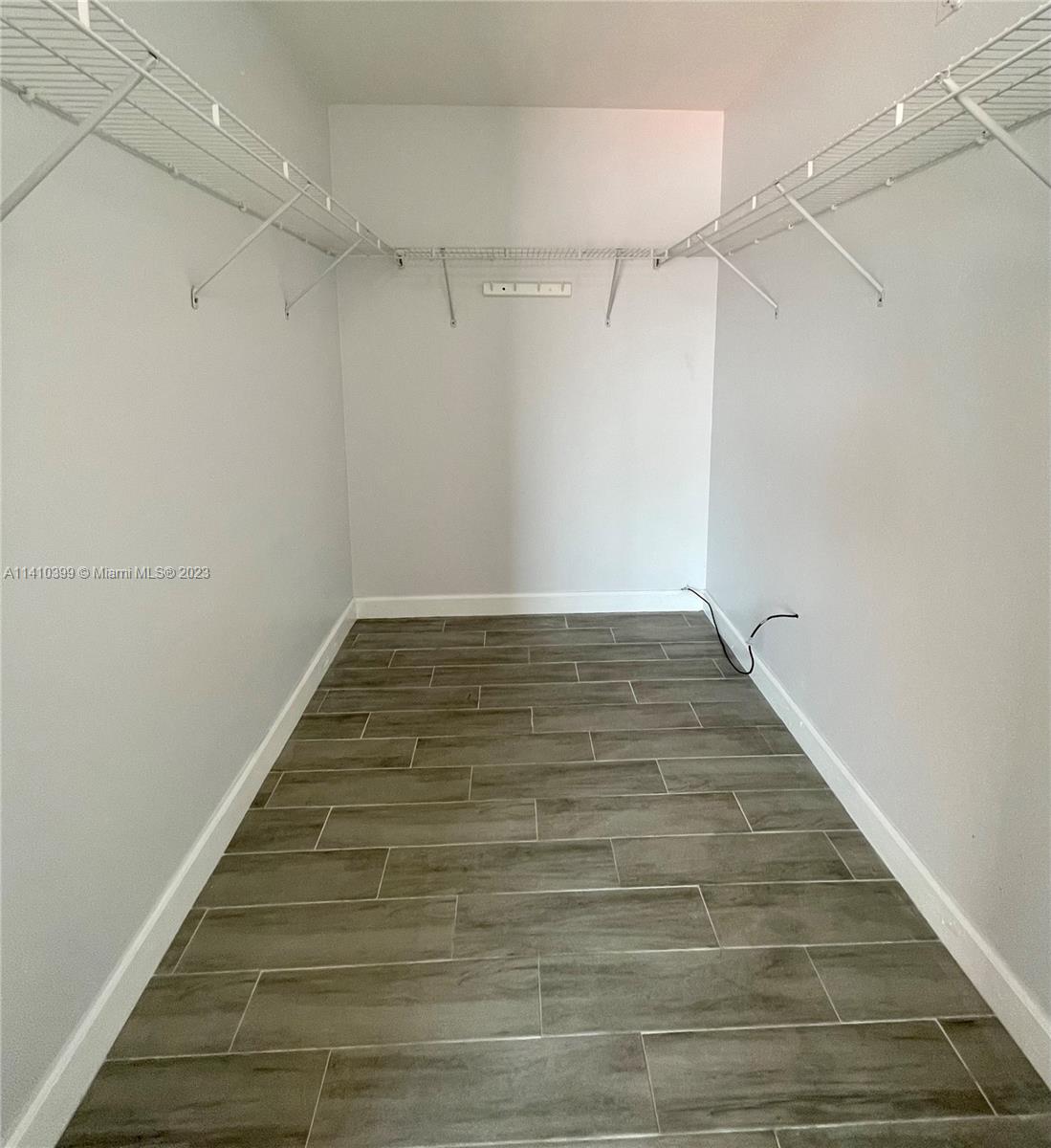 12030 Southwest 135th Terrace Miami, FL 33186 - Photo 12 of 27 a view of a room with wooden floor