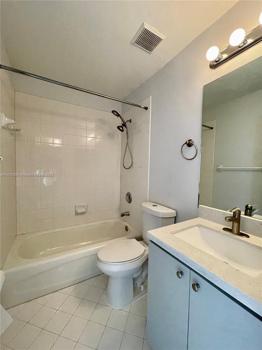12030 Southwest 135th Terrace Miami, FL 33186 - Photo 15 of 27 a bathroom with a sink toilet and shower