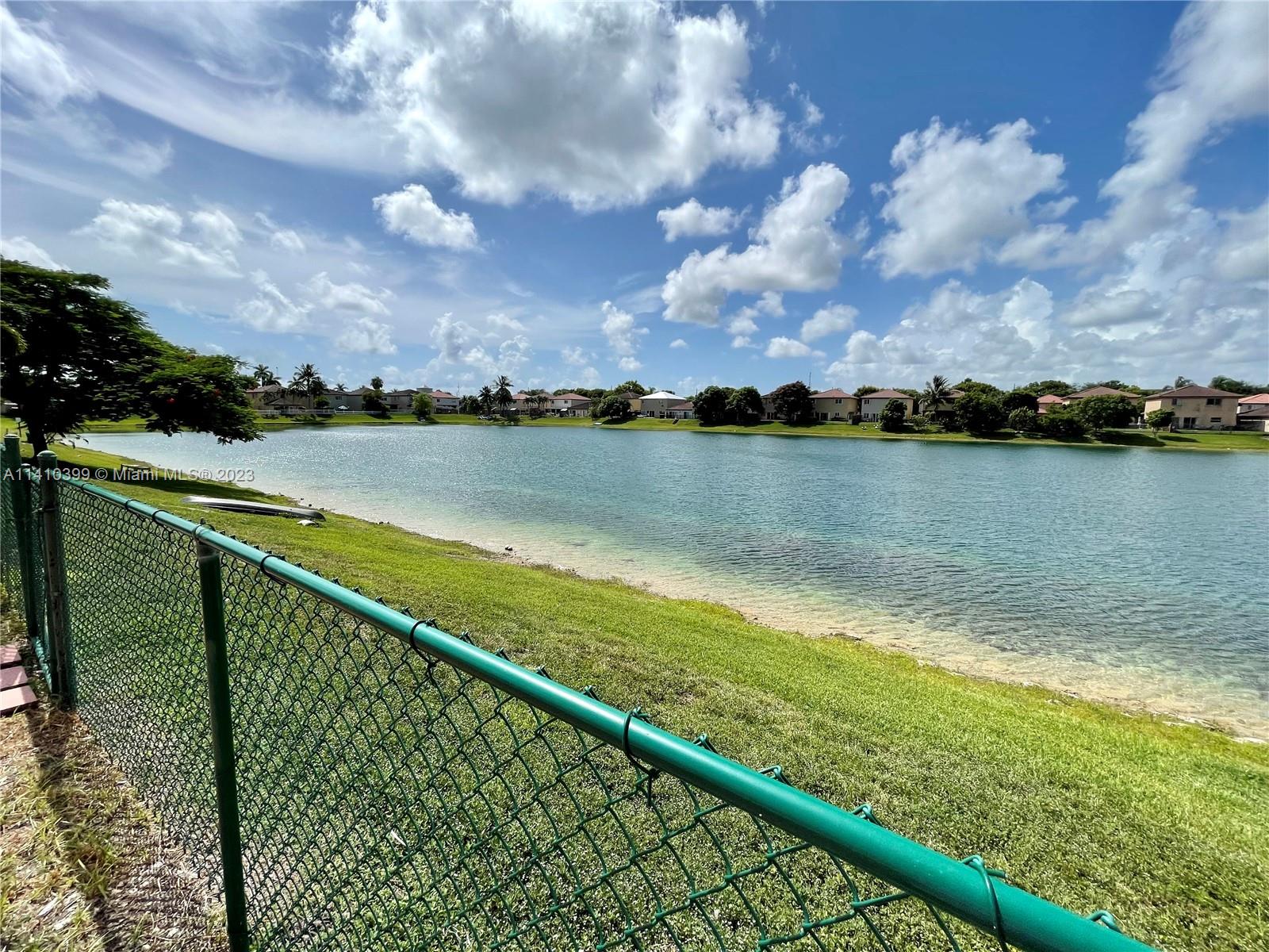12030 Southwest 135th Terrace Miami, FL 33186 - Photo 17 of 27 a view of a lake from a balcony