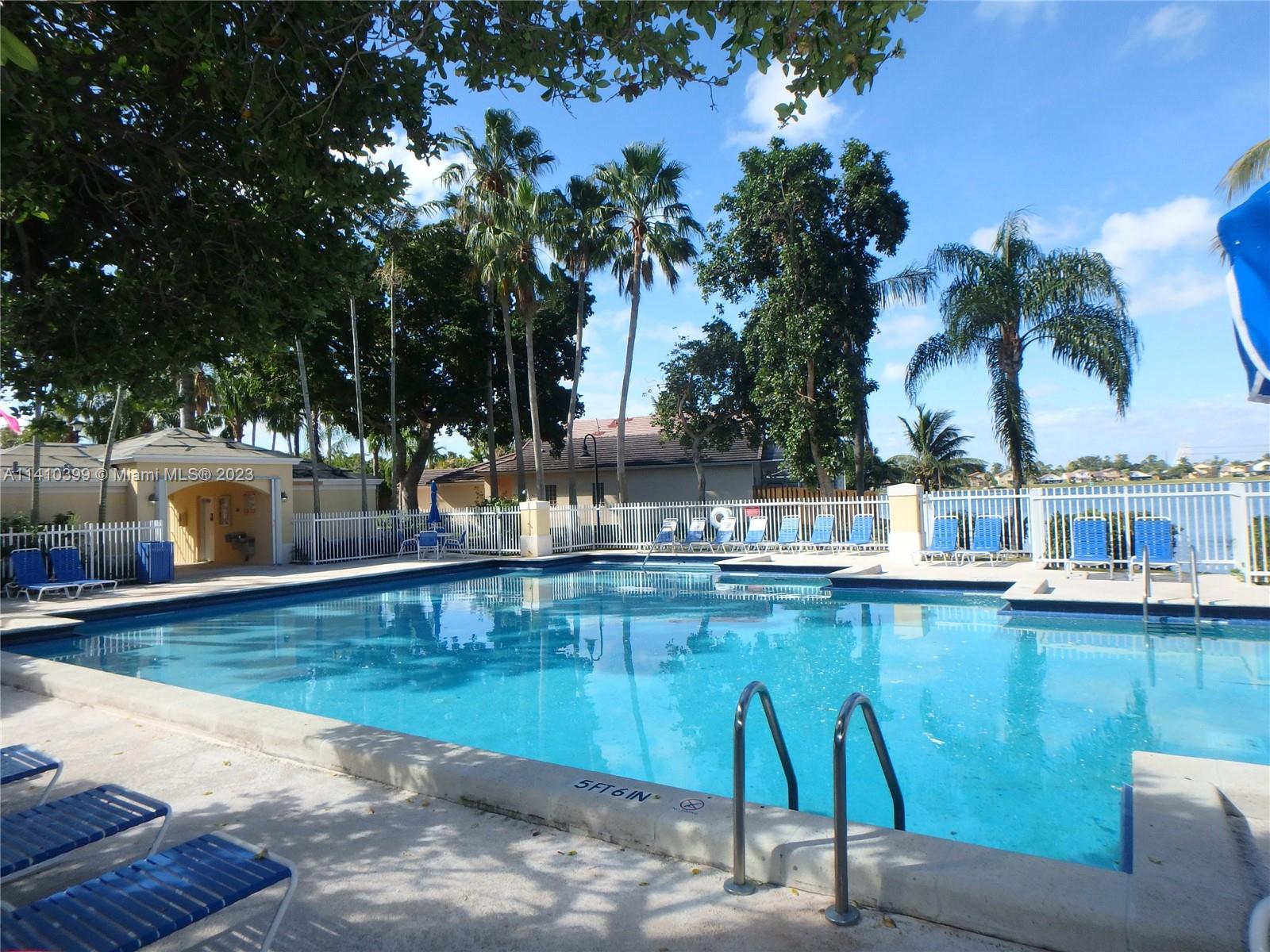 12030 Southwest 135th Terrace Miami, FL 33186 - Photo 19 of 27 a view of a swimming pool with a patio