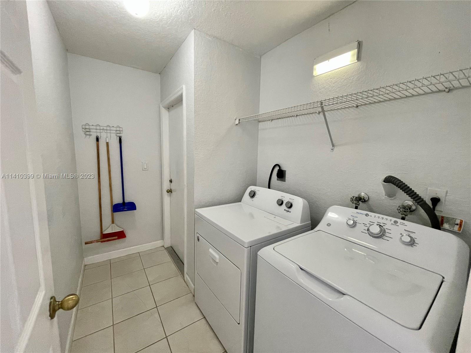 12030 Southwest 135th Terrace Miami, FL 33186 - Photo 10 of 27 a utility room with dryer and washer