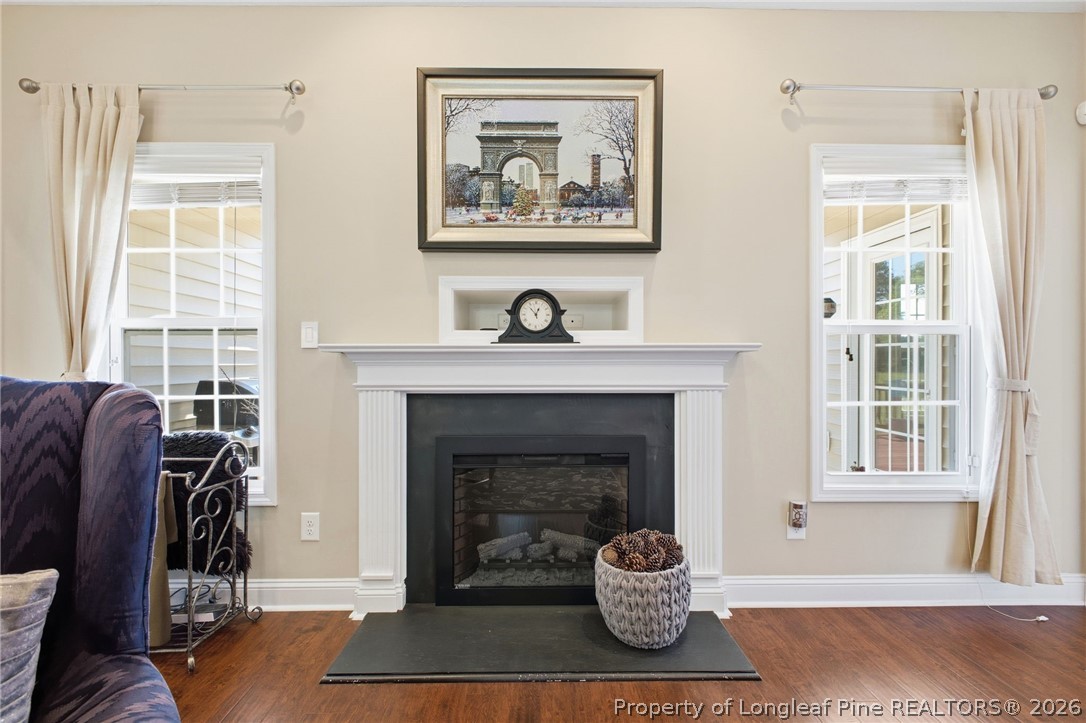2589 June Johnson Road Raeford, NC 28376 - Photo 6 of 49 a living room with furniture a window and a fireplace