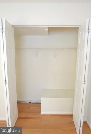 a view of walk in closet with clothes