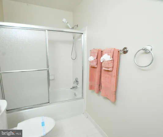 a bathroom with a shower curtain and sink