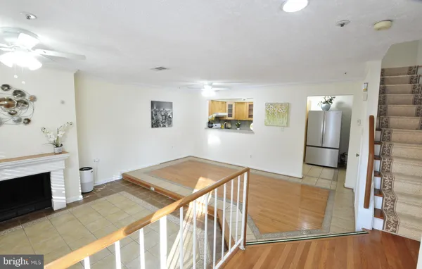 a view of a kitchen with furniture and a fireplace