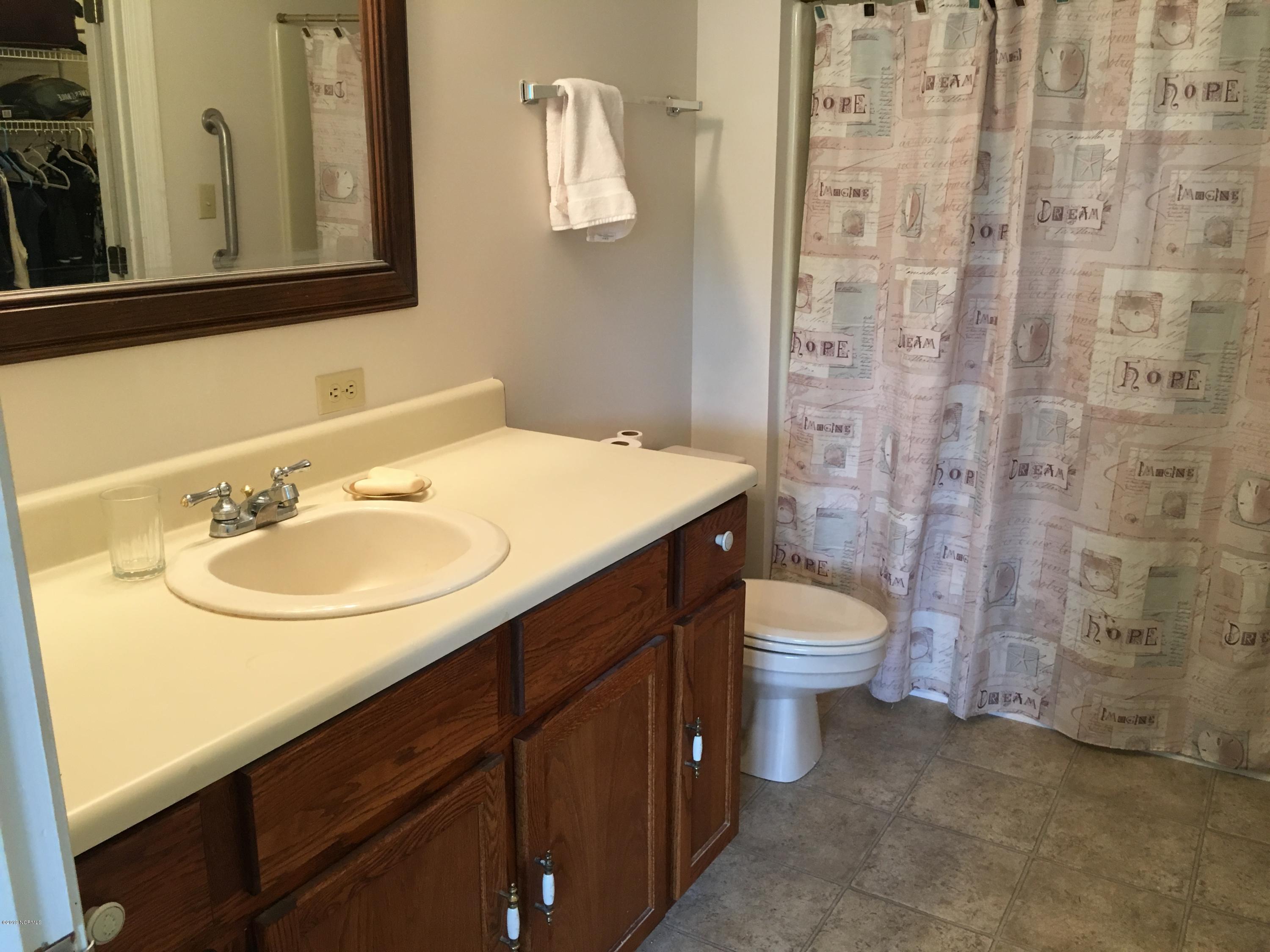 4958 St Rose Church Road Sims, NC 27880 - Photo 13 of 22 Principal bath has fiberglass tub with shower.