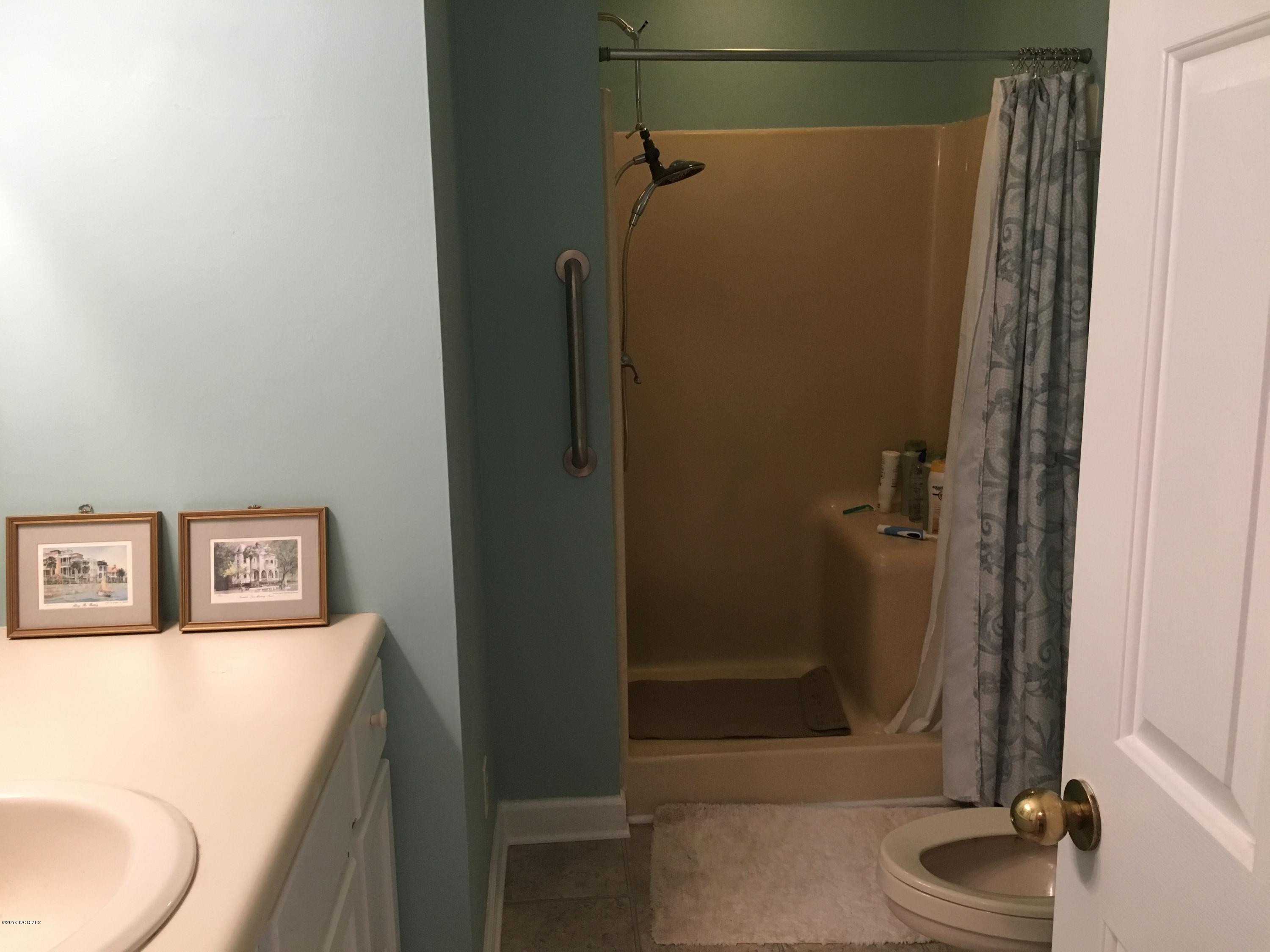 4958 St Rose Church Road Sims, NC 27880 - Photo 18 of 22 Hall bath has fiberglass walk-in shower with seat.