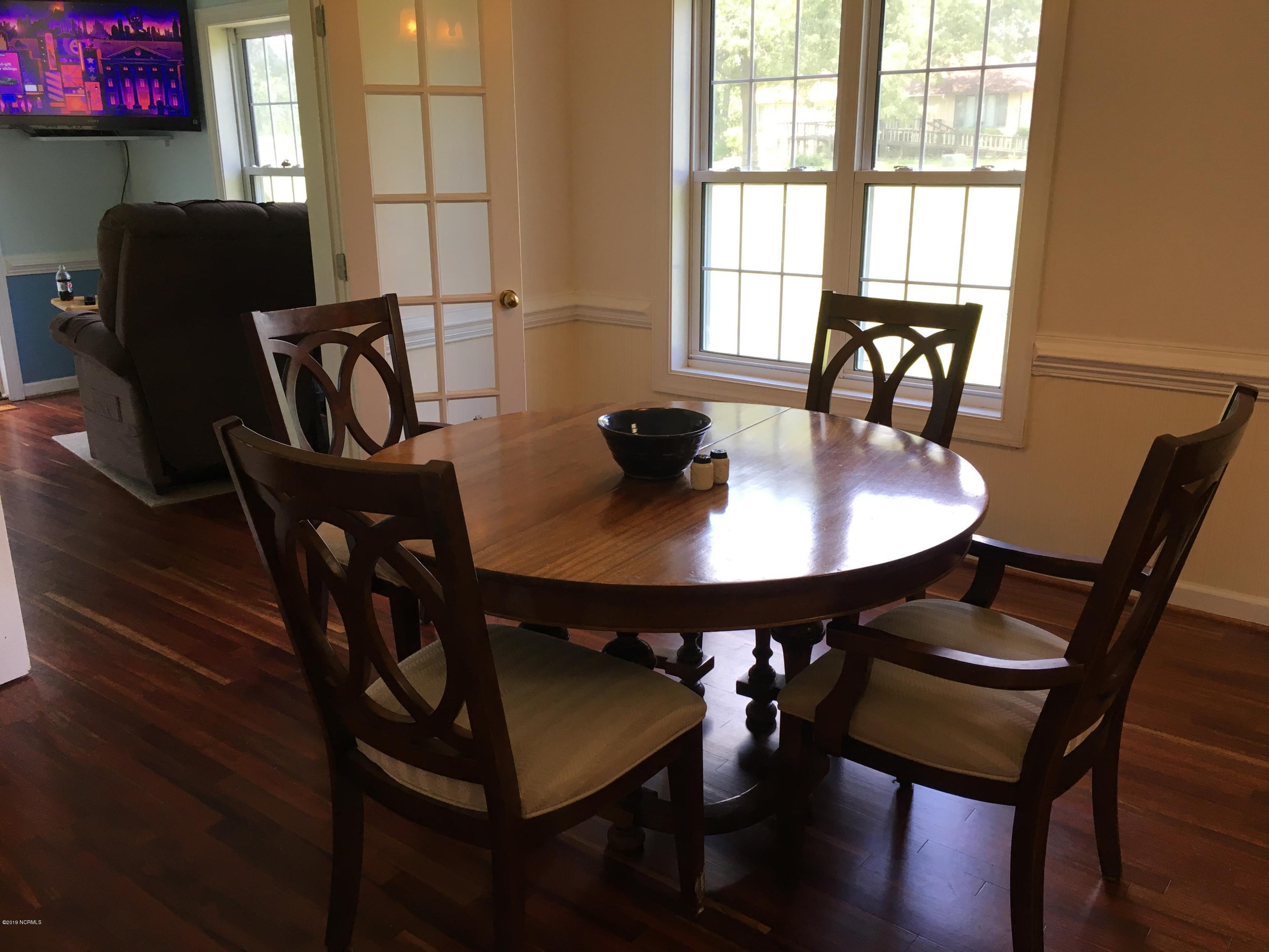 4958 St Rose Church Road Sims, NC 27880 - Photo 7 of 22 Dining area with den beyond.