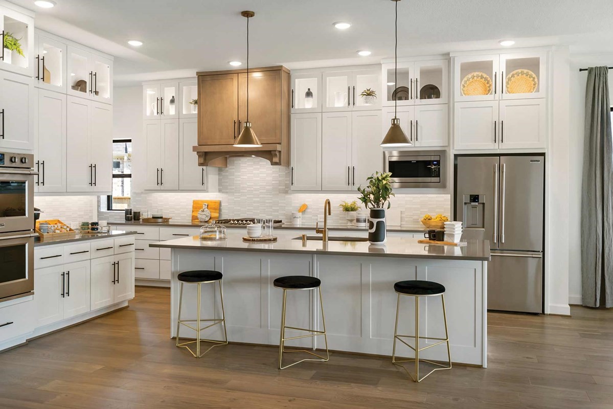 235 Painters Ridge Court Willis, TX 77318 - Photo 7 of 19 a kitchen with stainless steel appliances granite countertop a sink a stove a refrigerator and island with wooden floor