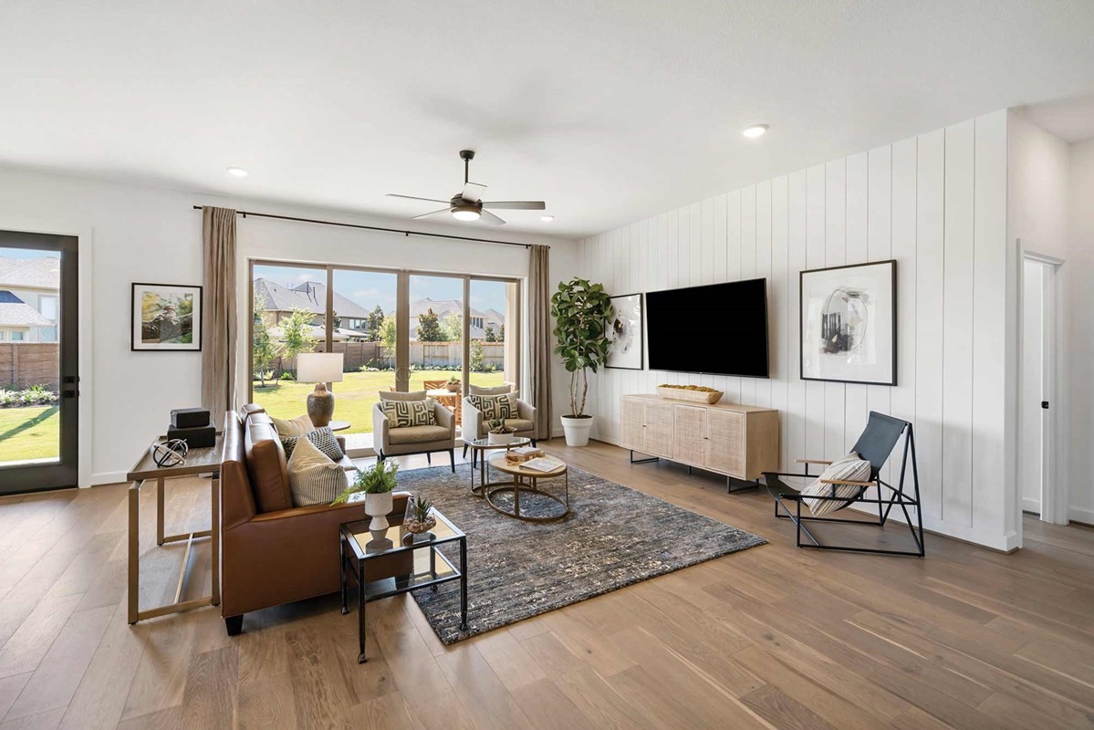 235 Painters Ridge Court Willis, TX 77318 - Photo 8 of 19 a living room with furniture and a flat screen tv