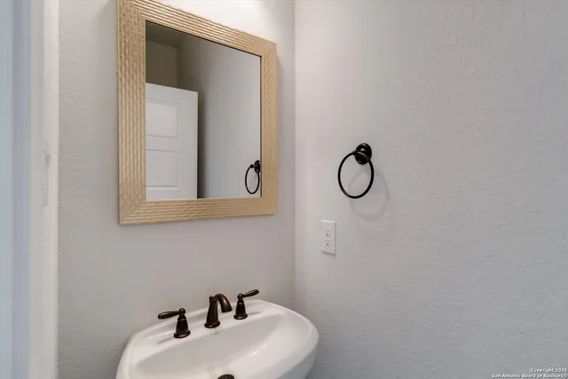 a bathroom with a toilet and a sink