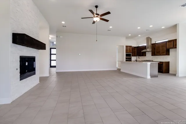 a view of a kitchen with a sink and a stove top oven